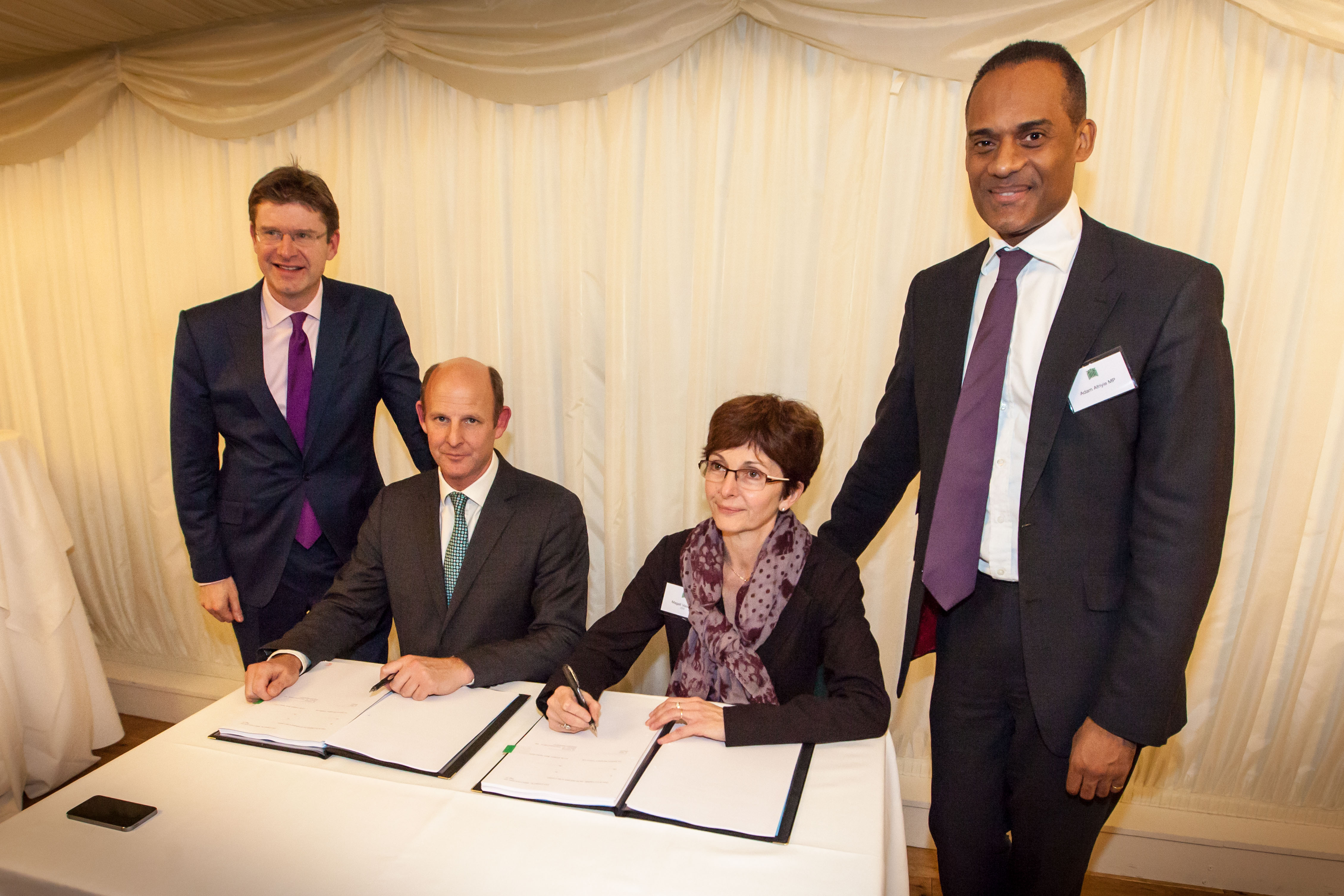 Iris Precursor Signing. Present: Magali Vaissiere, ESA's Director of Telecommunications and Integrated Applications, Rupert Pearce, CEO Inmarsat, Rt Hon Greg Clark, Minister of State for Cabinet Office and Minister for Universities and Science, and Member of Parliament Adam Afriyie.