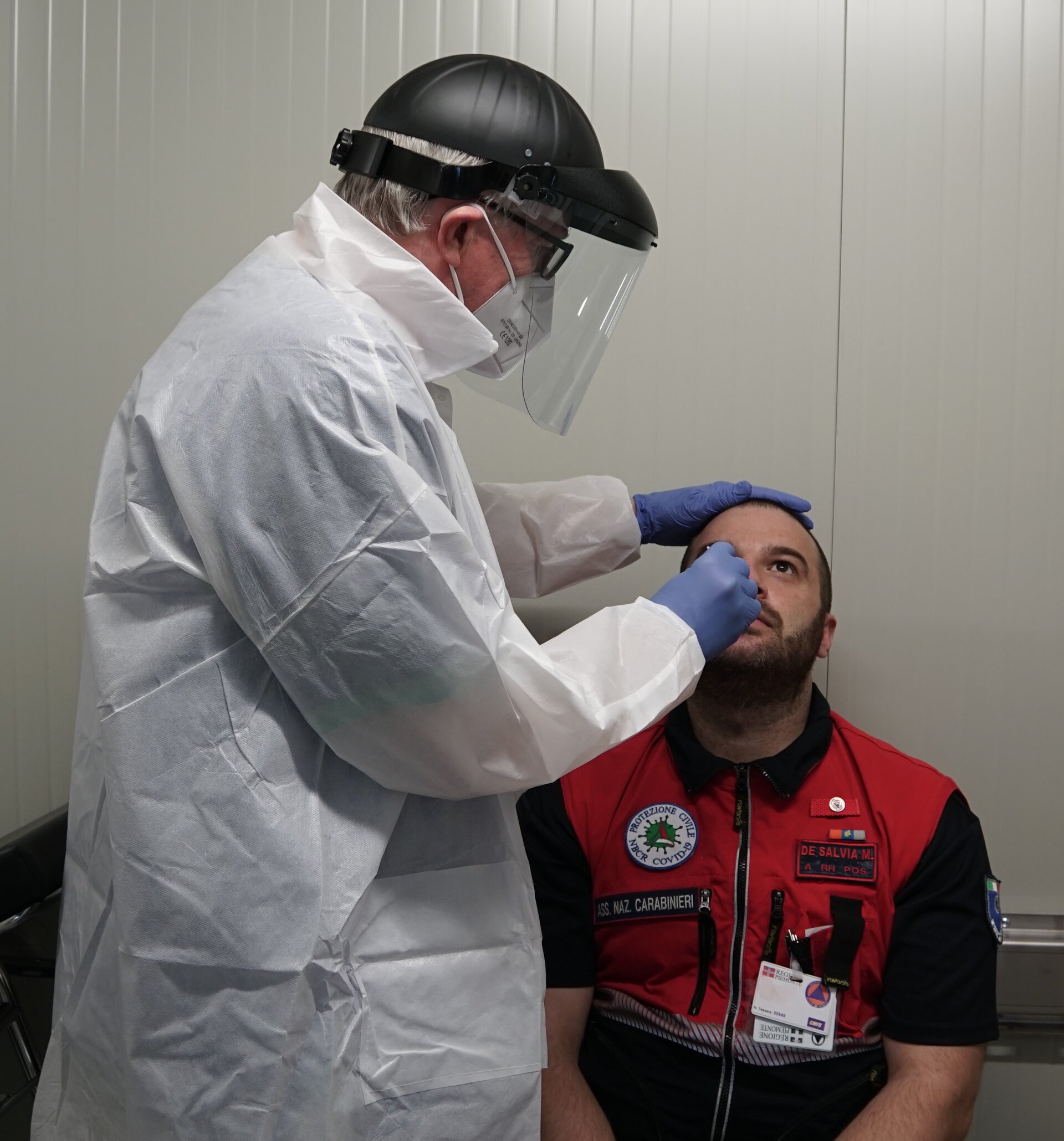 A nasal swab is taken from a key worker in Piedmont
