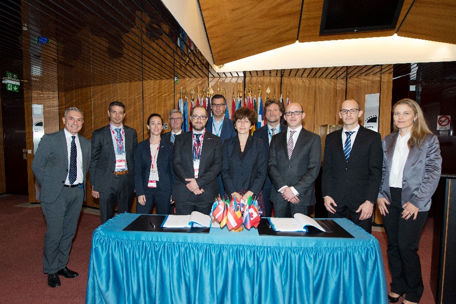 Magali Vaissiere with industry leads from ViaSat and the Swiss and Dutch national delegates during the contract signing at ESA HQ