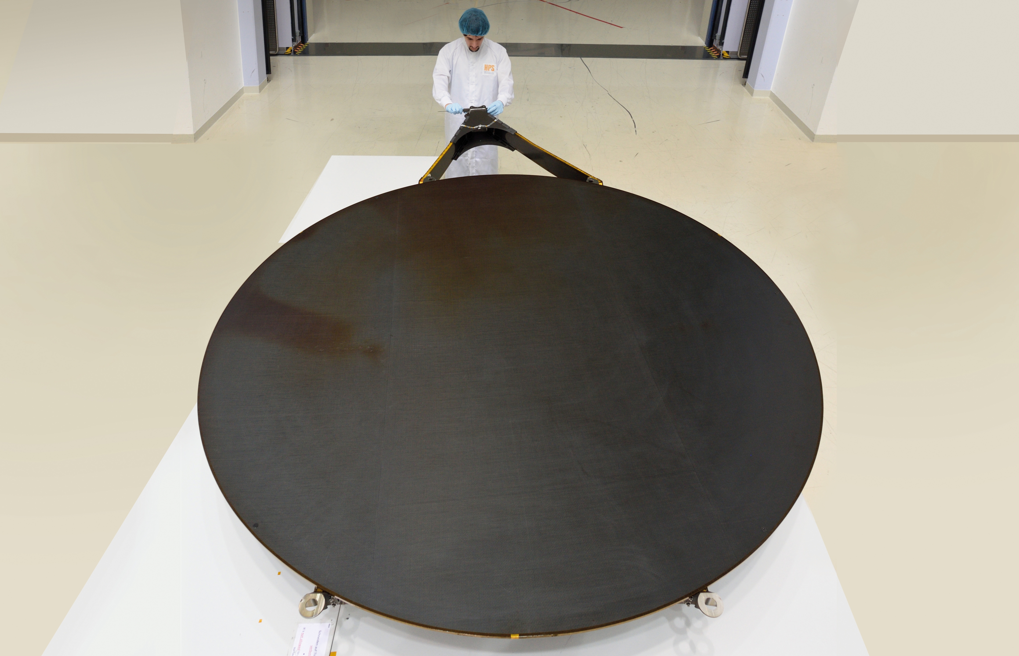 The 2.4 m Q-band reflector was developed, manufactured and successfully tested (vibration and acoustic loads, thermal vacuum cycling, thermo-elastic distortions and shape accuracy).  (Image credit: HPS GmbH)