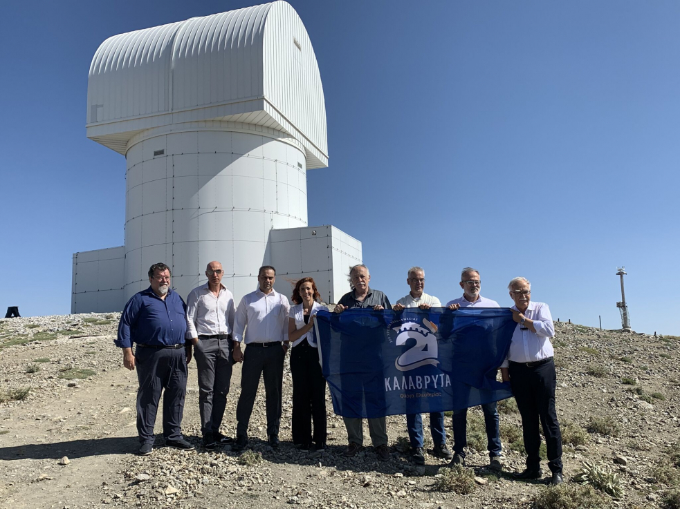 Local operator team posing in front of Helmos Observatory during ESA technical visit in August 2021